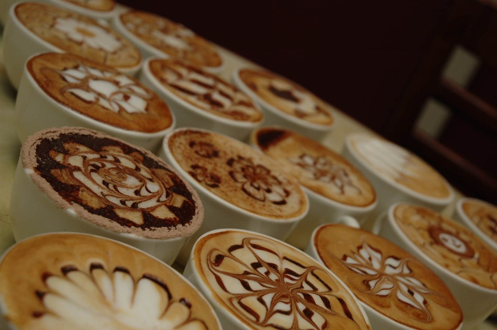 Barista pouring latte art at the Australian Barista School