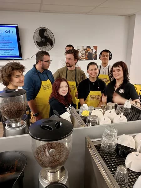 CBD College barista trainees in OzHarvest aprons during a Nourish Program class